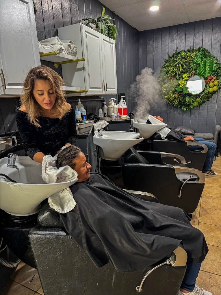 Stylist providing a luxury hair wash treatment at Amora Leah Beauty Salon